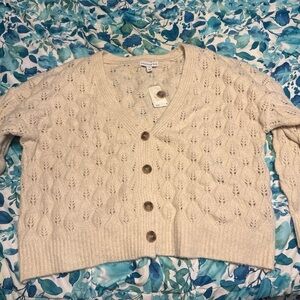 NWT beautiful soft creme sweater .